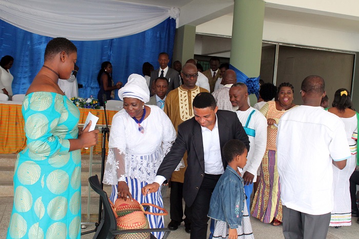 Mrs Mawusi Nudekor Awity (2nd left), the Executive Director of National Vocational Training Institute (NVTI), and some invited guests giving their offering